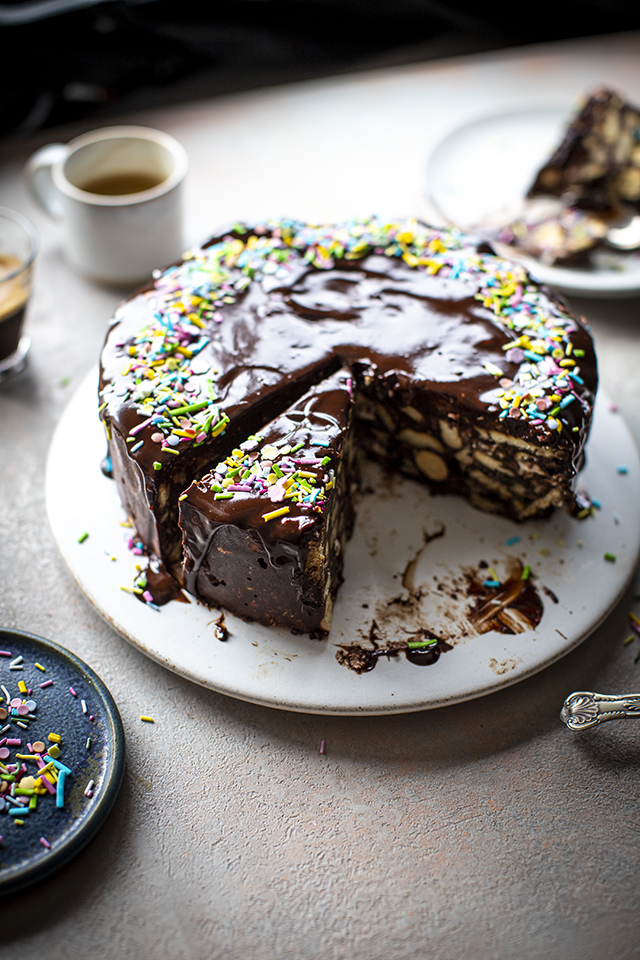 Brown Chocolate Biscuit Cake Served On Wooden Table With Coffee And Set Of  Forks, Viewed From High Angle Stock Photo, Picture and Royalty Free Image.  Image 132956561.