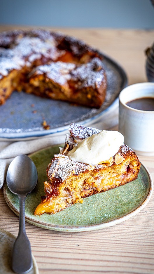 AD Plum & Almond Cake Served with Vanilla Whipped MascarponeThis cake pairs the warmth of cardamom and cinnamon with the sweetness of roasted plums and a creamy vanilla mascarpone. It’s simple and perfect for sharing. Swap in any stone fruit you like!  Made with the best of ingredients from your local dunnesstores! 

Serves: 8
Time: 60 minutes

For the cake:
110g butter plus extra for greasing
150g soft light brown sugar
2 large Free range eggs
210g plain flour, sifted
1 tsp of baking powder
pinch of salt
1 tsp ground cinnamon
2 tsp ground cardamom
6 plums, sliced in half
50g flaked almonds
Honey to drizzle
For the vanilla mascarpone:
250g of mascarpone
2 tbsp of icing sugar, sifted
1 tsp vanilla bean paste
 
Preheat the oven to 180°C/350°F/Gas Mark 4. Grease and line a 20cm cake tin with a removable base with parchment paper.
While the oven is preheating, slice the plums in half and remove the stone. Place in a baking tray and sprinkle with some caster sugar and a couple of tablespoons of water. Roast in the oven for 30-35 minutes. Cover with tinfoil halfway through cooking. 
Beat the butter and sugar in a large bowl until pale. Add the eggs, one at a time, mixing until they are incorporated. Fold through the flour, baking powder, salt, cardamom and cinnamon until you have a thick cake batter.
Once the fruit is roasted, remove from the oven and roughly chop half of the plums to mix through the cake batter.  Set the other half aside to press into the batter when it is in the tin
Stir through the chopped plums and pour the batter into the cake tin. The batter is thick so use a spatula to spread across the base of the tin.
Gently press the plum halves into the batter and sprinkle with the almonds. Bake in the oven for 40-45 minutes. Cover with tin foil if you find the almonds brown too much.
Remove from the oven and leave to cool and generously sprinkle with icing sugar
For the vanilla mascarpone, mix together the mascarpone, icing sugar and vanilla bean paste.
Serve generous slices of the cake with a dollop of the vanilla mascarpone.